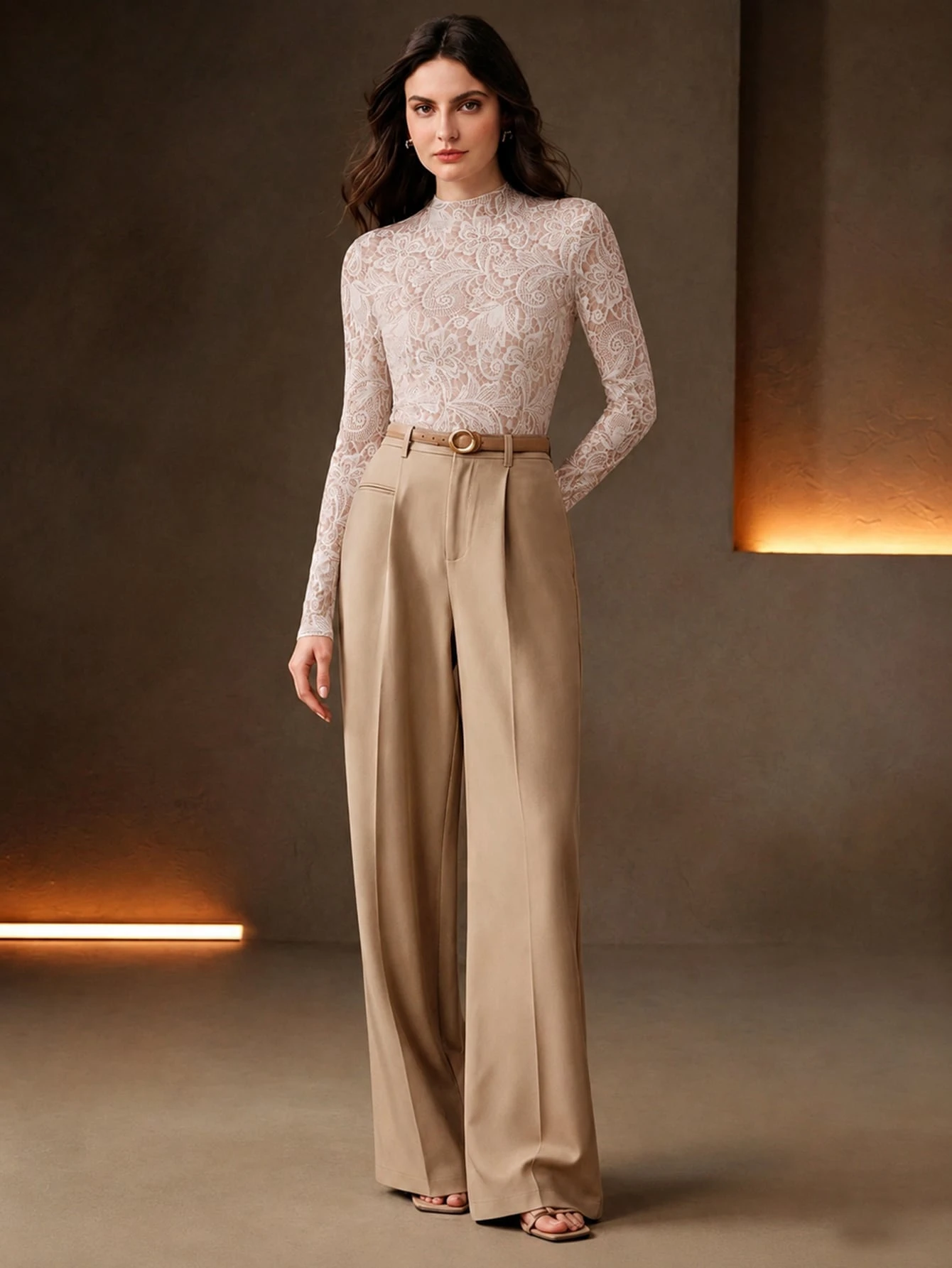 Blush lace top and straight trouser outfit with leather ankle boots and statement earrings