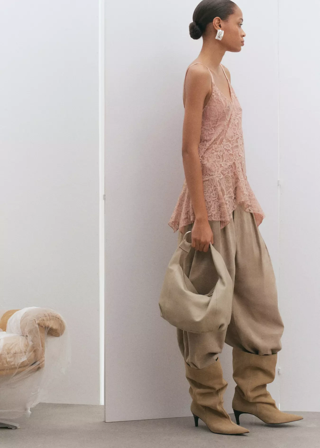 Blush lace top and palazzo trouser outfit with leather ankle boots and silver drop earrings