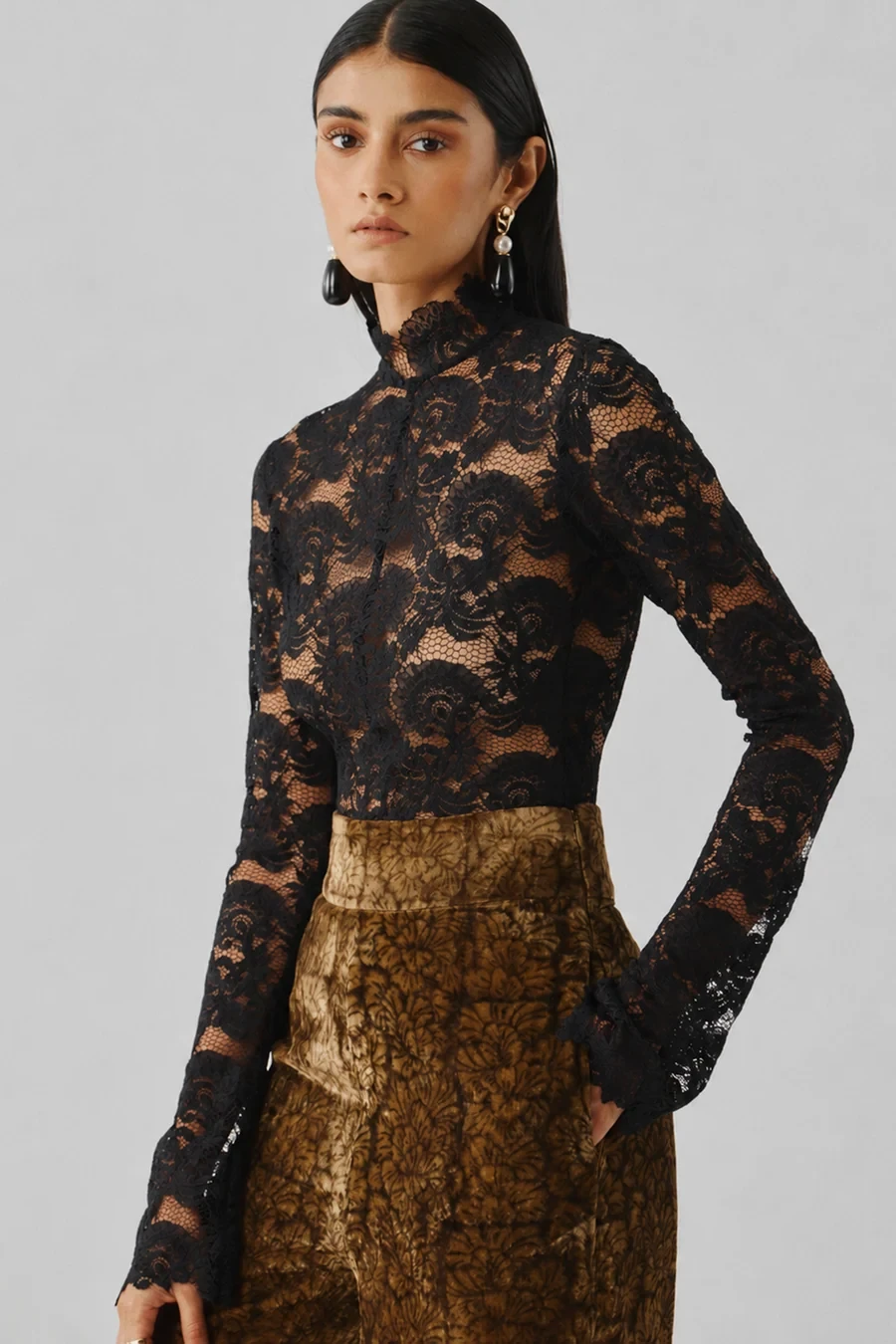 Black lace top and velvet trouser outfit with pointed mules and silver drop earrings