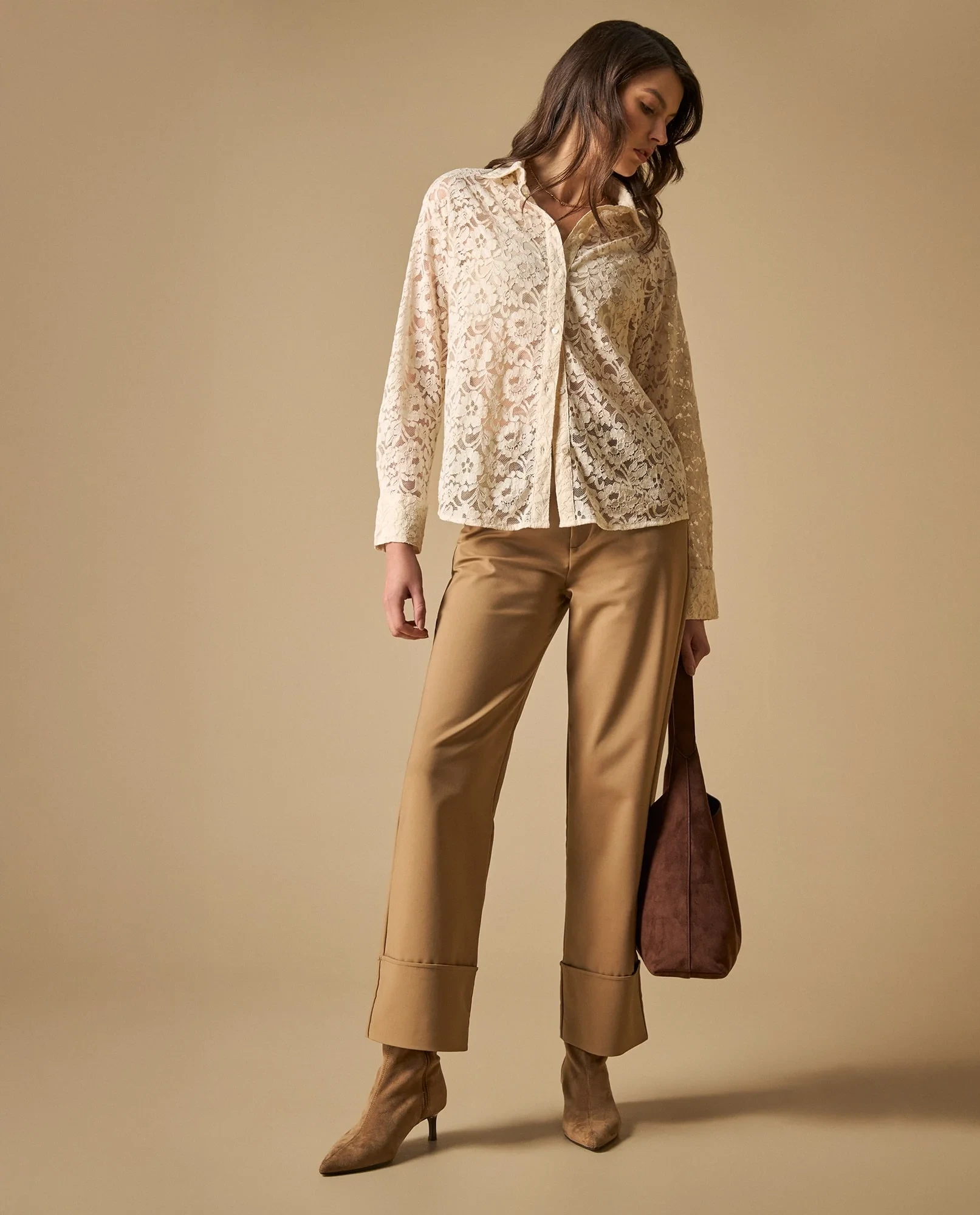 Blush lace top and straight trouser outfit with suede ankle boots and a small structured clutch