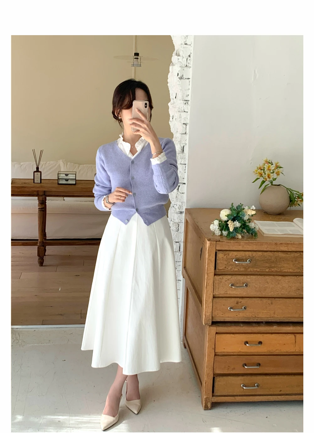 Lavender cardigan sweater with a white A-line skirt