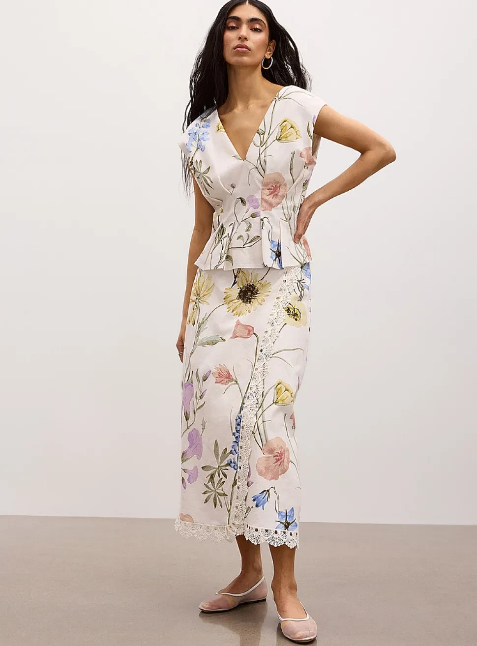 Floral Peplum Jacket and Slip Dress with gold hoop earrings