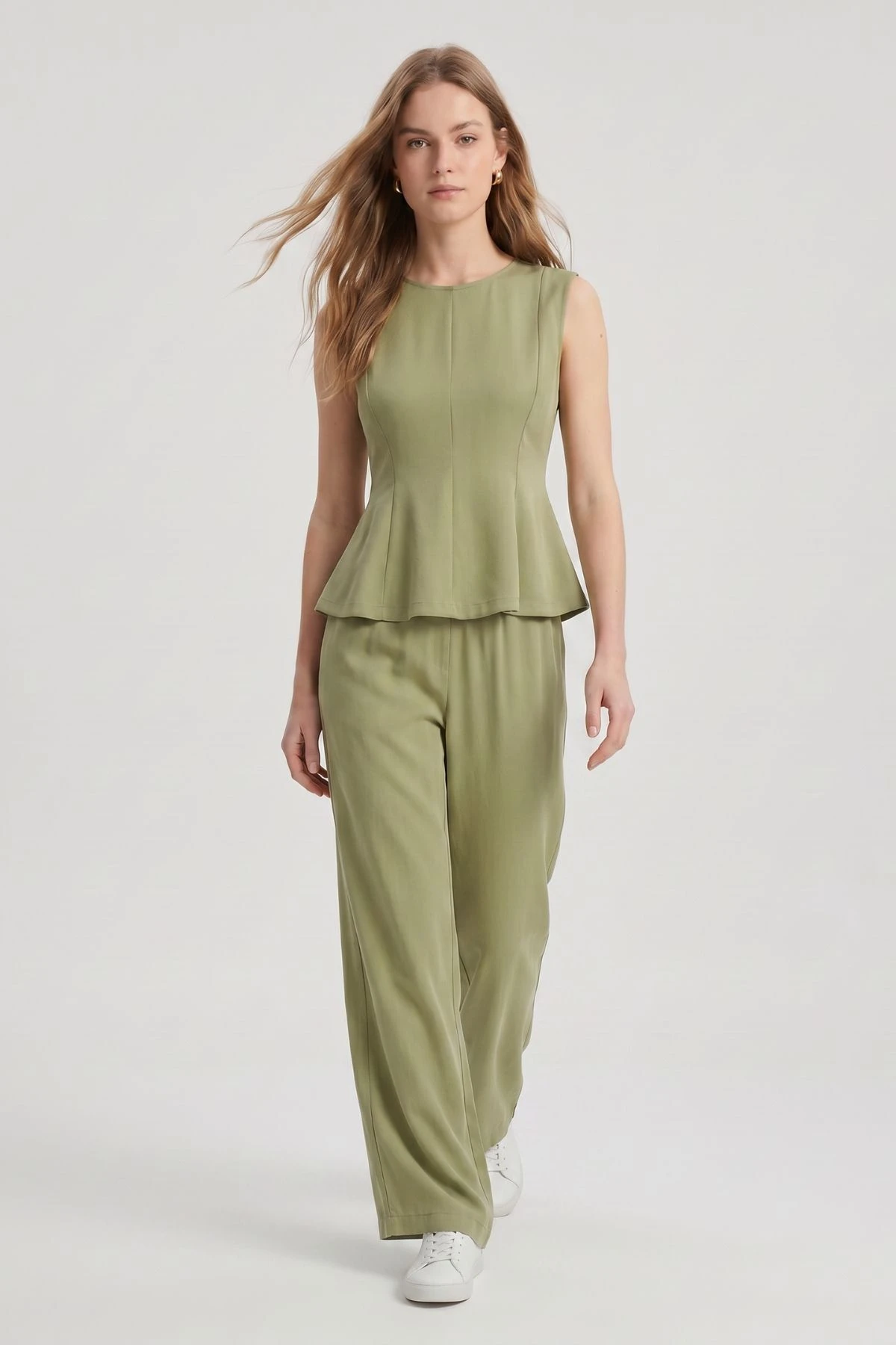Sage Peplum Knit Top and Wide-Leg Trousers with gold hoop earrings