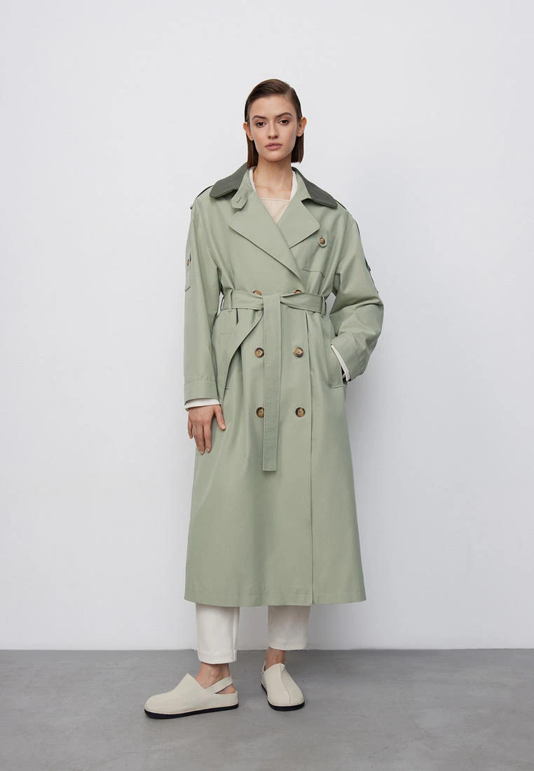 Sage longline coat with white trousers
