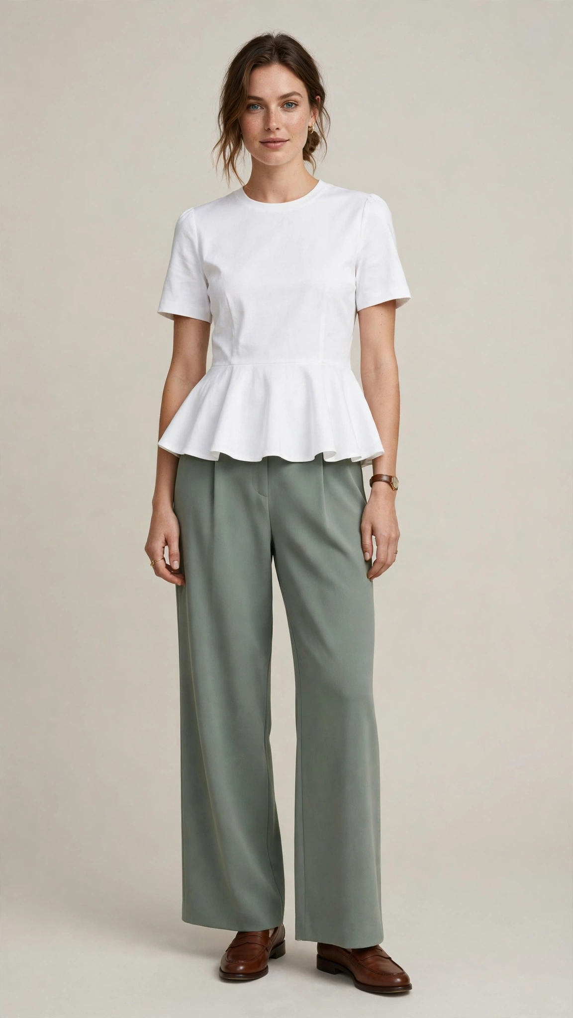 Sage green crepe trousers with a white peplum top
