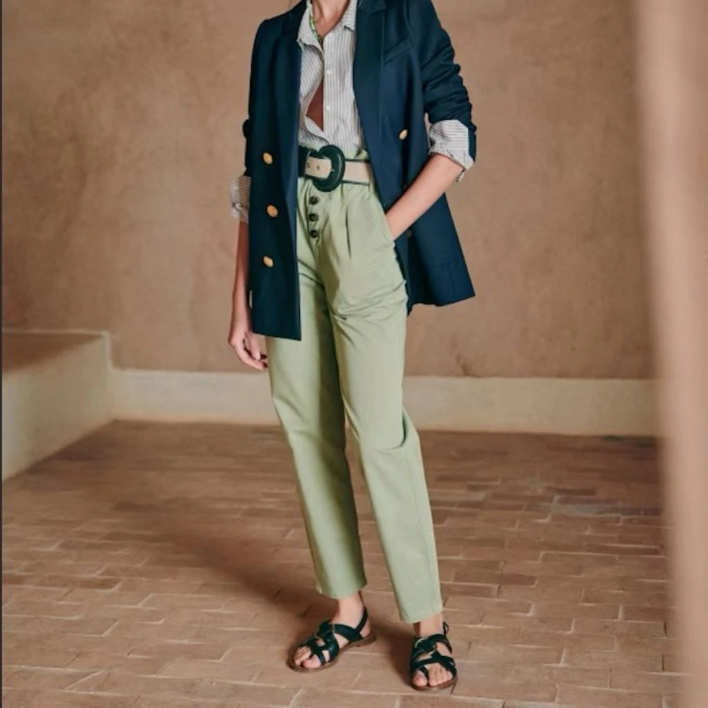 Sage green crepe trousers with a navy blazer