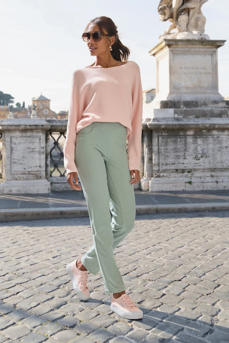Sage green cropped trousers with a pale pink cashmere sweater
