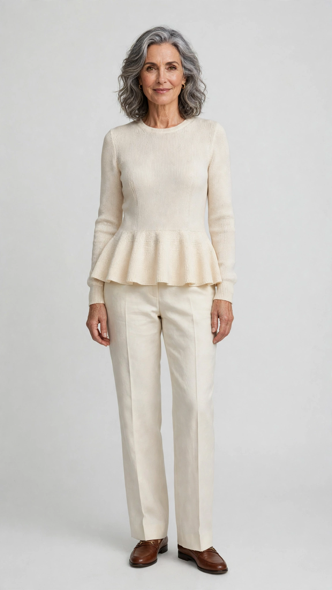 40 Women Over 50 Peplum Blouse and Trouser Outfits for March Office Days That Are Fresh, Chic and Easy to Wear 9 Peplum knit blouse with cream trousers