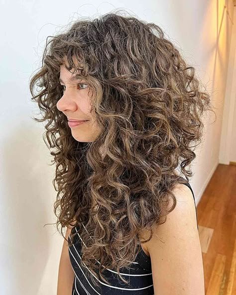 Natural Texture Spring Hairstyles For Curly Hair With Defined Curls With A Sleek Straight Finish, Long Soft Layers And A Fresh Salon Shine