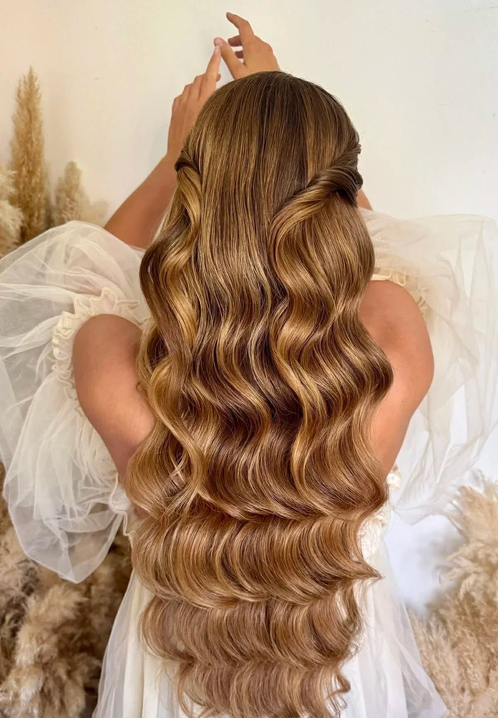Natural Texture Spring Hairstyles For Wavy Hair With A Salt Spray Finish With Smooth Glossy Lengths, A Deep Side Part And Soft Golden Pieces