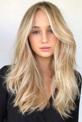 Natural Texture Spring Hairstyles For Wavy Hair With A Salt Spray Finish With A Relaxed Lived-In Wave, Curtain Pieces And Delicate Blonde Dimension