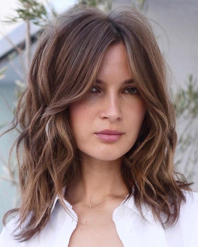 Natural Texture Spring Hairstyles For Wavy Hair With A Salt Spray Finish With Soft Waves, Graduated Layers And Warm Chestnut Warmth