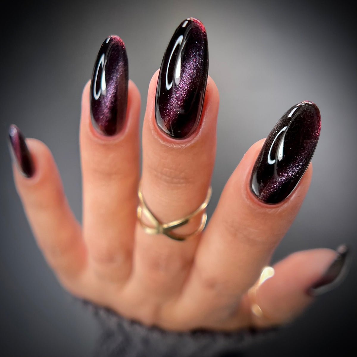 Almond Black Plum Cat Eye Nails for January Evenings