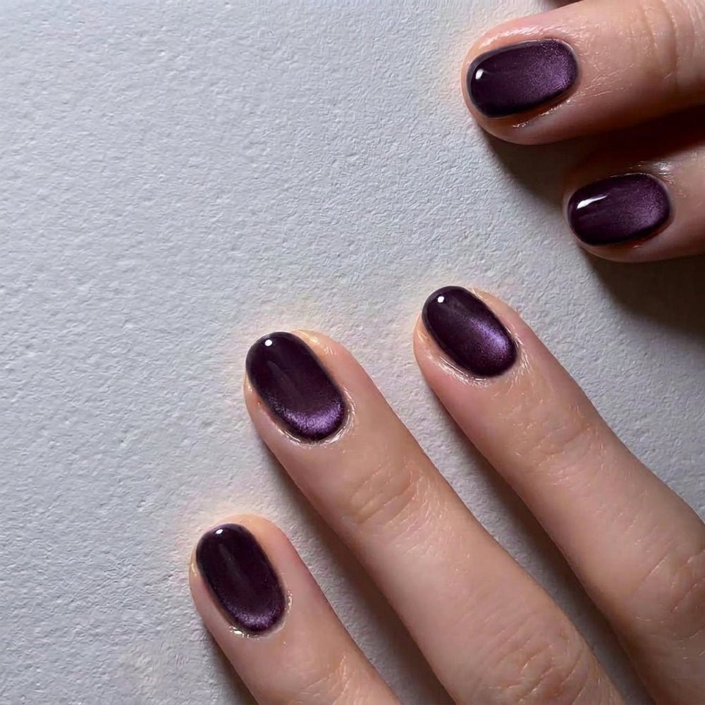 Short Dark Plum Cat Eye Nails for January Evenings