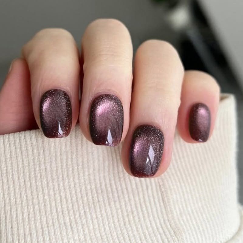 Plum Cat Eye Nails for January Evenings with a Gentle Magnetic Line