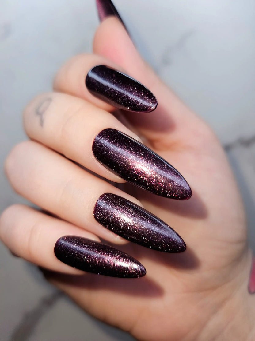 Stiletto Plum Glitter Cat Eye Nails for January Evenings