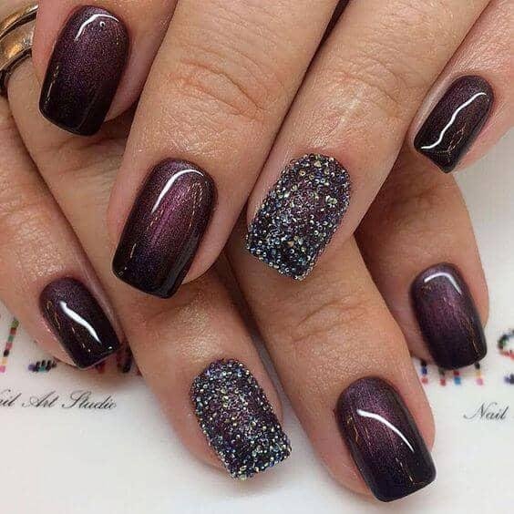 Dark Plum Cat Eye Nails with a Glitter Accent Nail for January Evenings