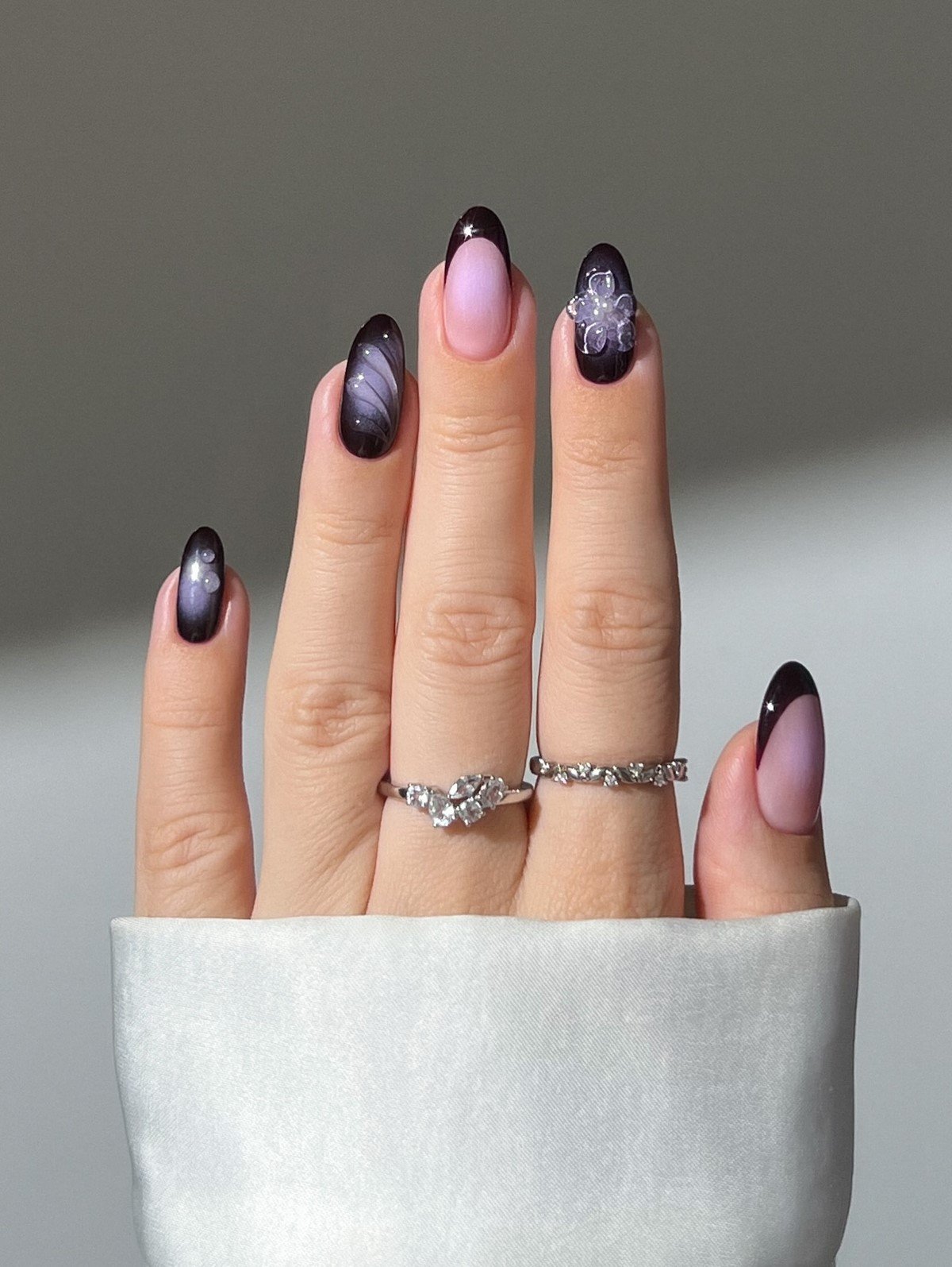 Dark Plum Cat Eye Nails with a French Tip Accent for January Evenings