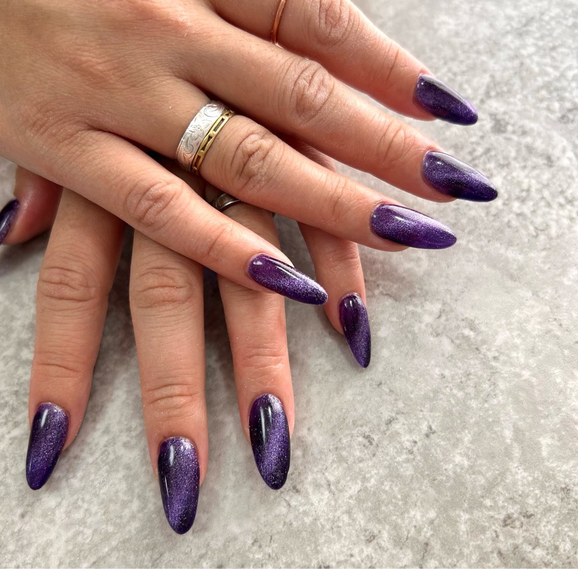 Almond Deep Purple Cat Eye Nails with a High Shine Finish for Winter Parties
