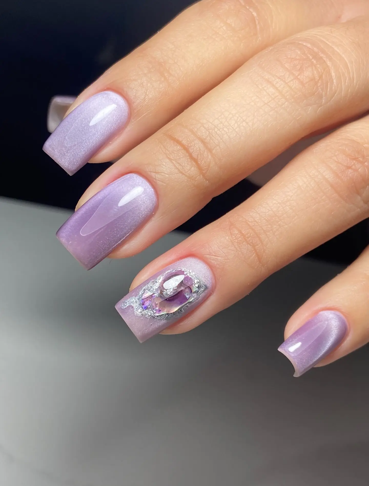 Square Light Lavender Cat Eye Nails with a Gem Accent Nail for Winter Parties