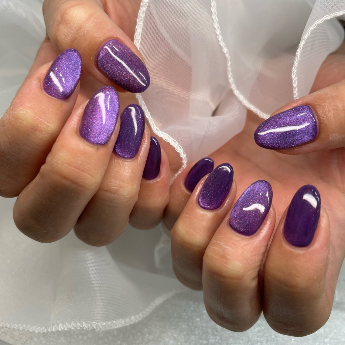 Purple Cat Eye Nails for Winter Parties with a Soft Gloss Finish