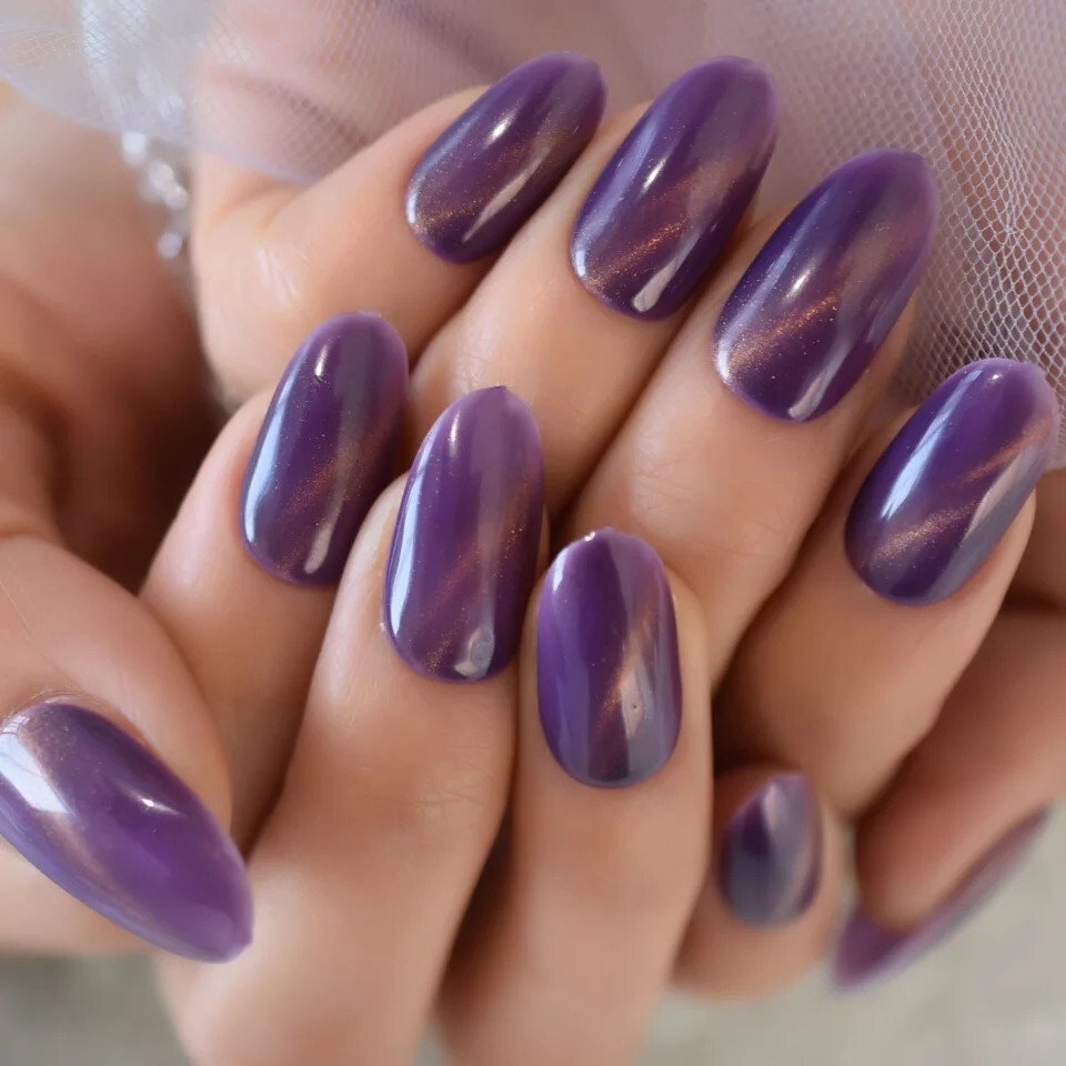 Almond Purple Cat Eye Nails with a Bright Magnetic Line for Winter Parties