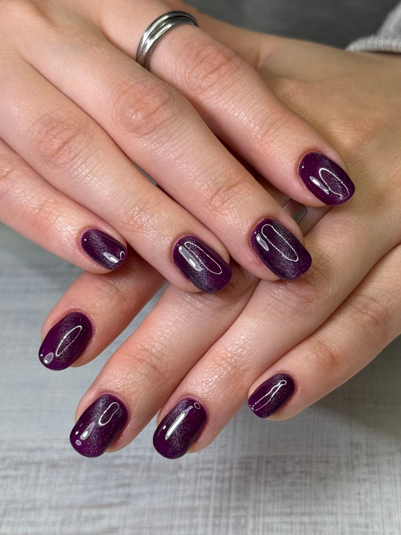 Short Oval Deep Purple Cat Eye Nails for Winter Parties