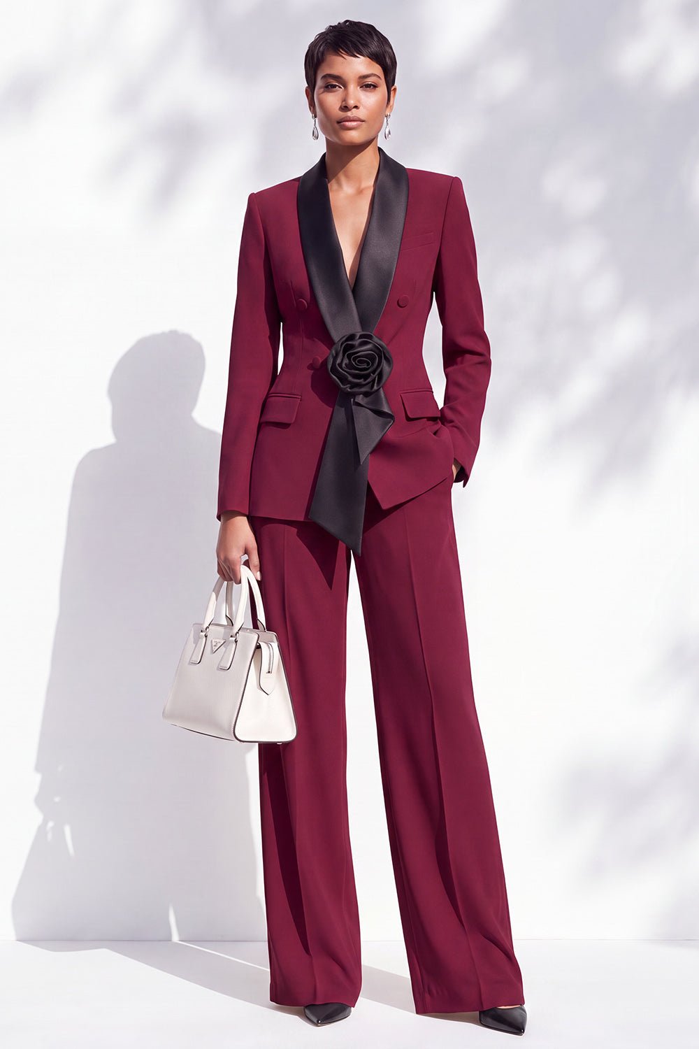Burgundy Tuxedo Suit with a White Handbag