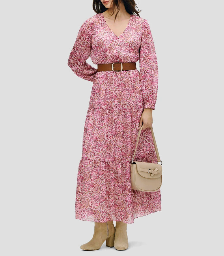 Fuchsia pink tiered skirt outfit with block-heel ankle boots and a chic crossbody bag