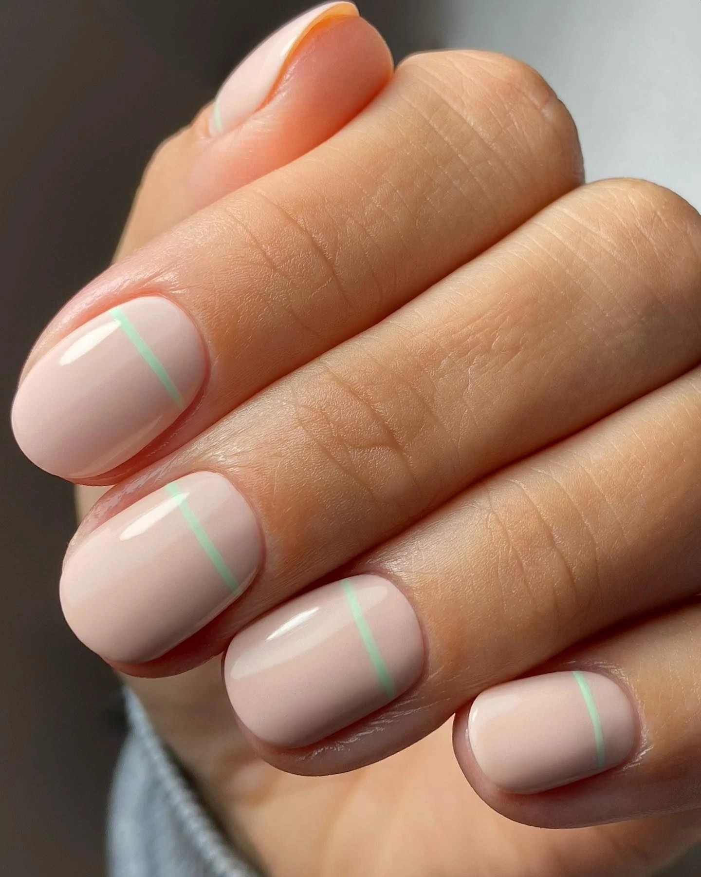 Rounded Square Pistachio Green Minimalist Nails with a matte finish and a minimal stripe