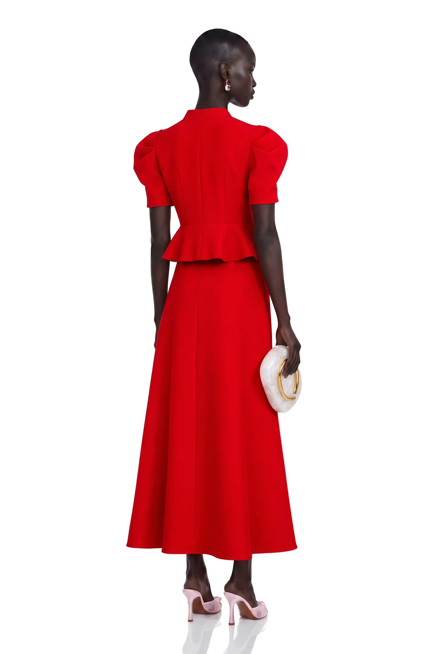 Bright red blouse and flared skirt outfit with pointed mules and a small structured clutch