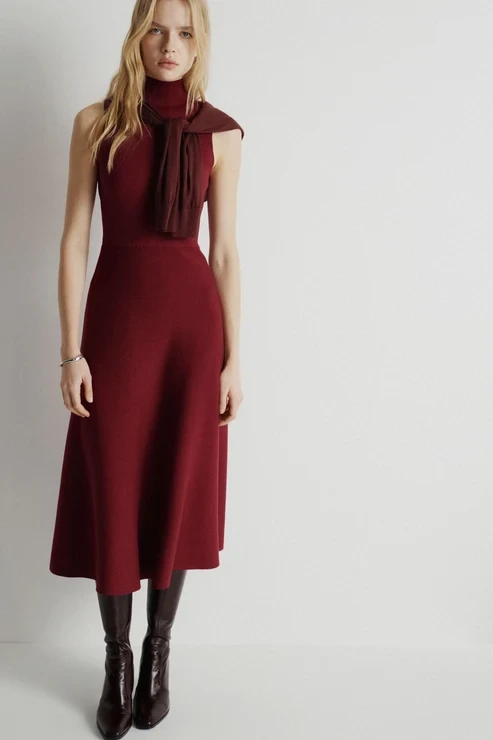 Deep red chunky knit dress with block-heel ankle boots and a silk scarf