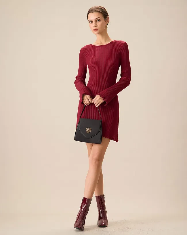 Deep red long-sleeve knit dress with leather ankle boots and a small structured clutch