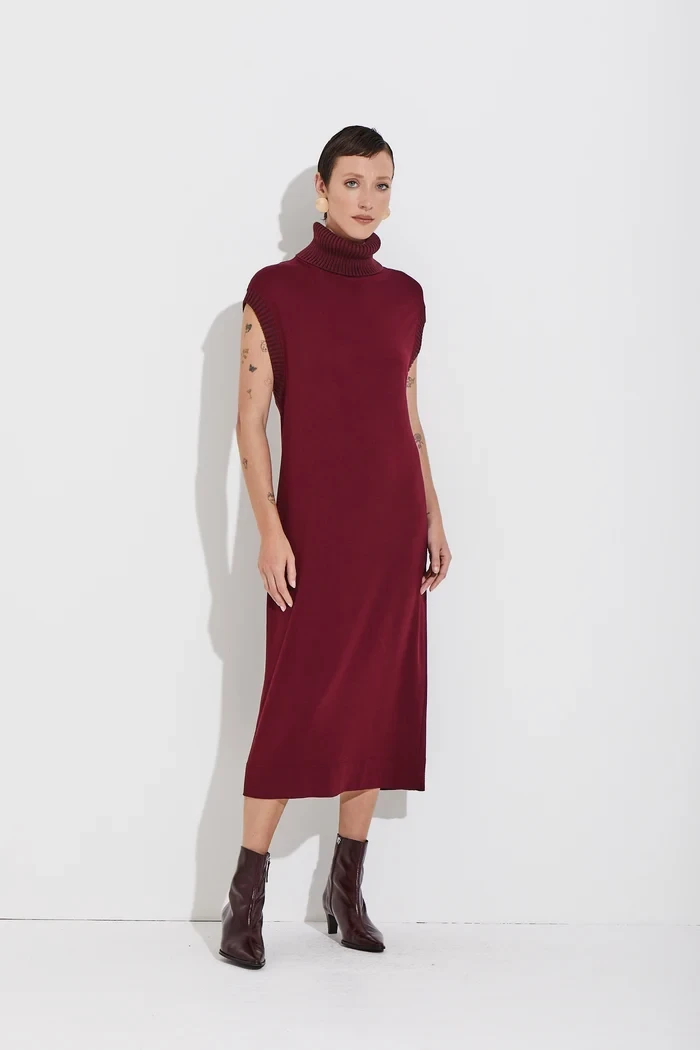 Wine A-line knit dress with block-heel ankle boots and silver drop earrings