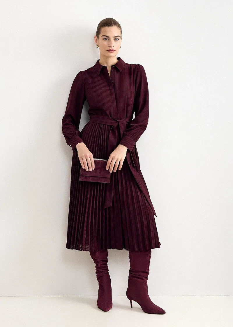 Scarlet pleated midi dress with suede ankle boots and a small structured clutch