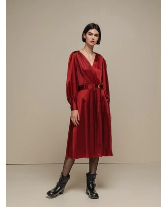Deep red satin bias-cut dress with block-heel ankle boots and a slim leather belt
