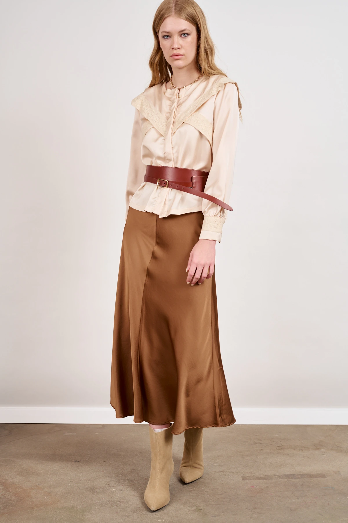 25 Ruffle Blouse Outfits for Valentine Dinners That Are Chic, Romantic and Easy to Wear 26 Cream ruffle blouse and satin trouser outfit with suede ankle boots and a slim leather belt
