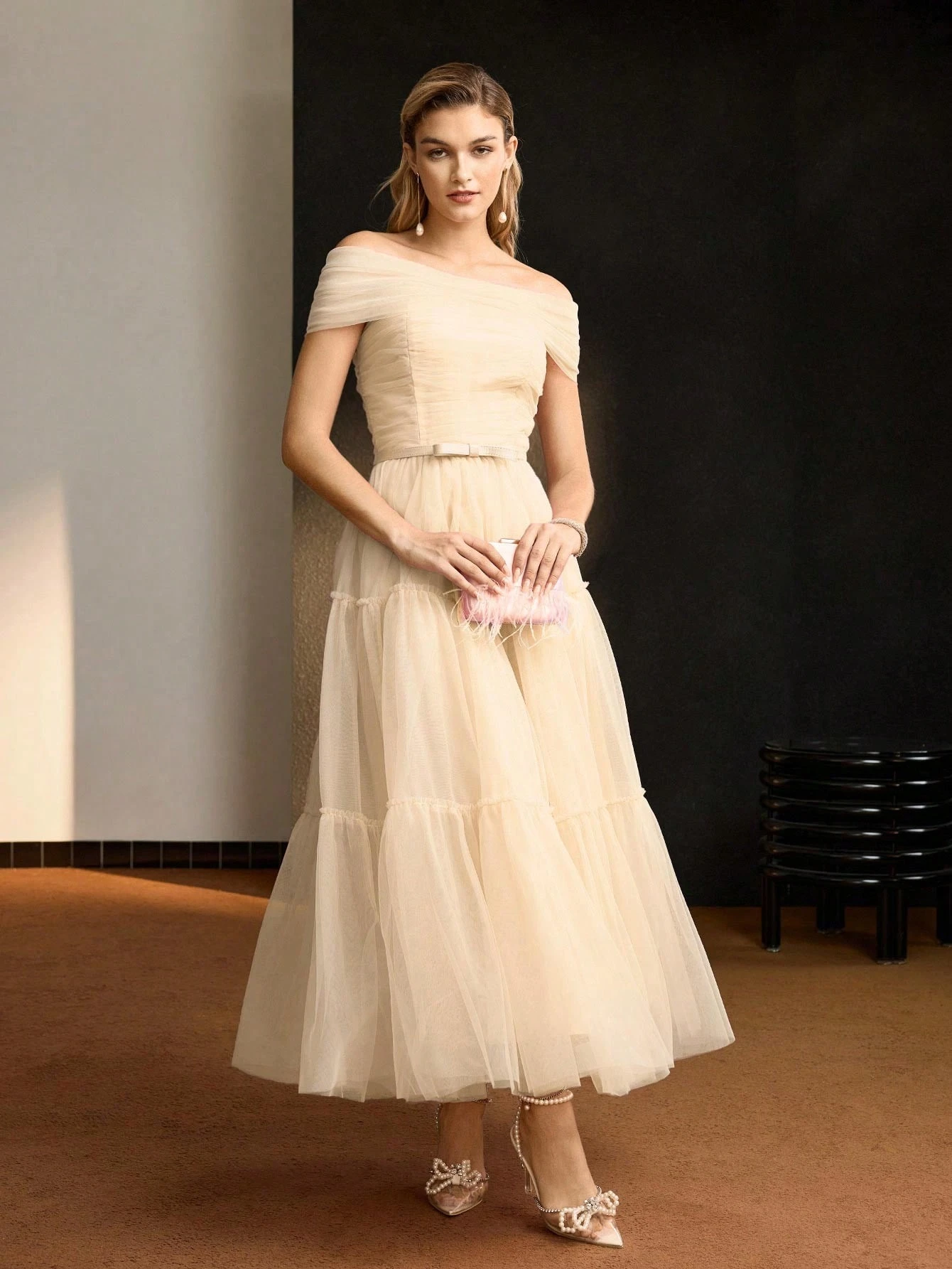 Champagne ruffle off-shoulder dress with elegant pointed flats and a slim leather belt