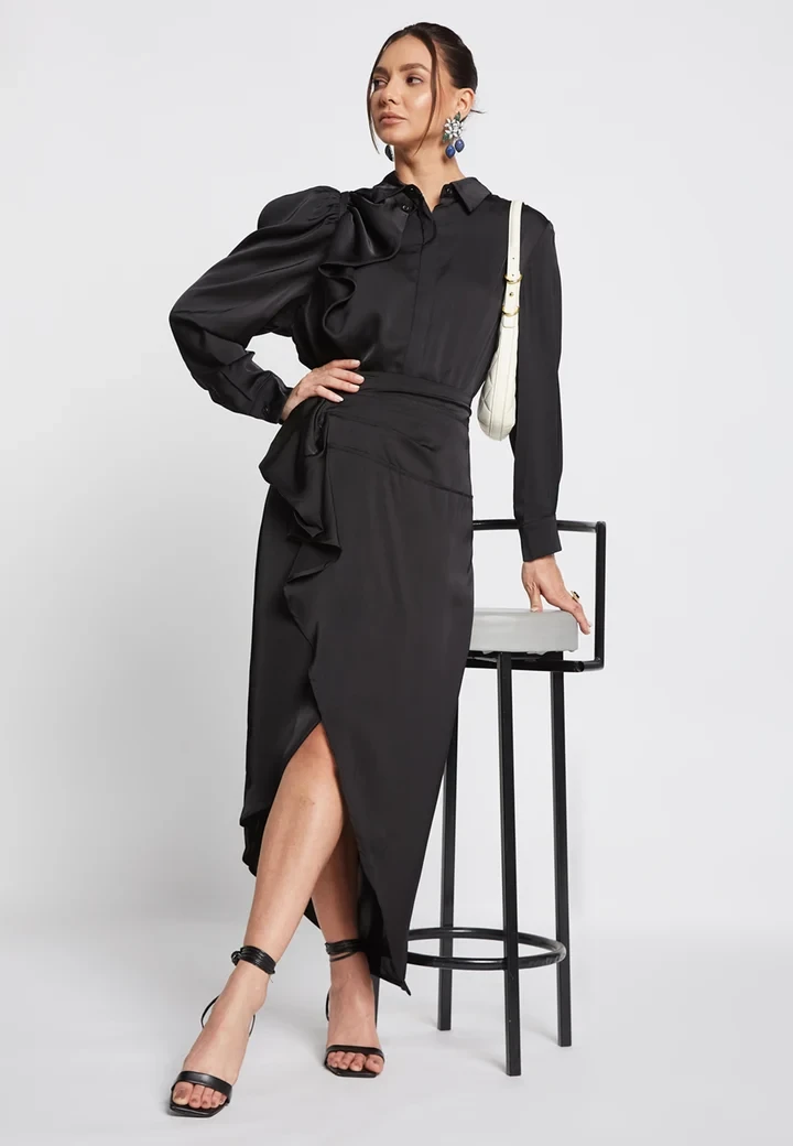 Black ruffle satin skirt outfit with kitten heels and a chic crossbody bag