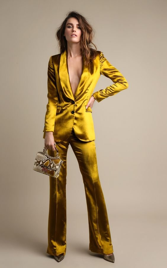 Gold Satin Tuxedo Suit with a Snakeskin Clutch
