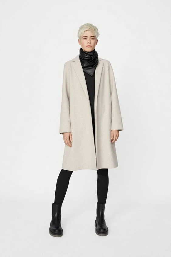 30 Scarf and Coat Layering Outfits for Snowy Walks That Are Chic, Warm and Elegant 4 Cream Coat with a Black Knit Scarf with Black Leggings and Black Ankle Boots