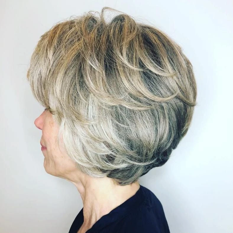 38 Sleek Winter Blowout Hairstyles for Women Over 50 With a Side Part That Are Chic, Polished and Easy to Wear 34 Sleek Side Part With Feathered Ends