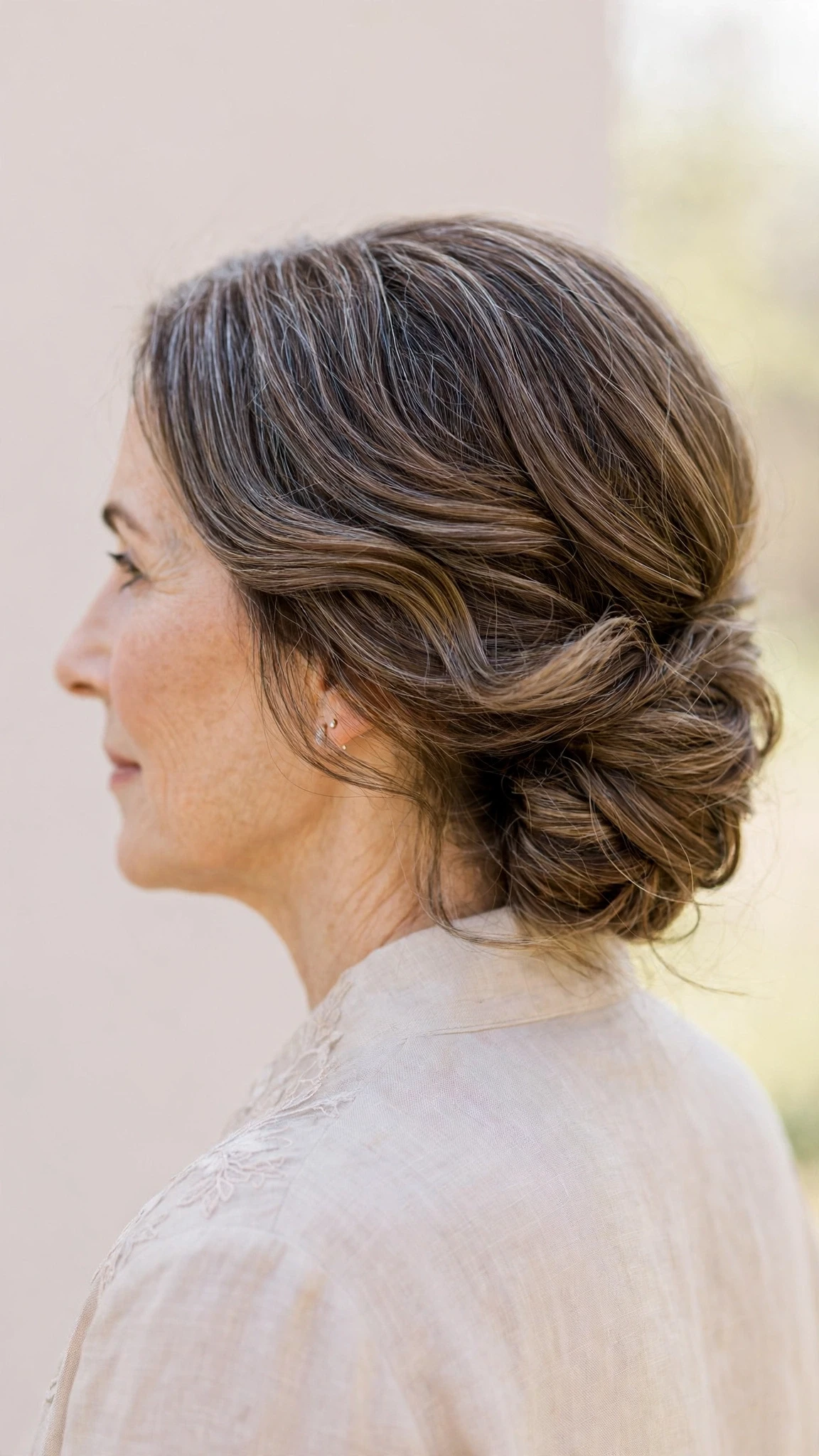 Spring Chignon Hairstyles For Spring Weddings With Soft Waves, Graduated Layers And A Glossy Shine Finish
