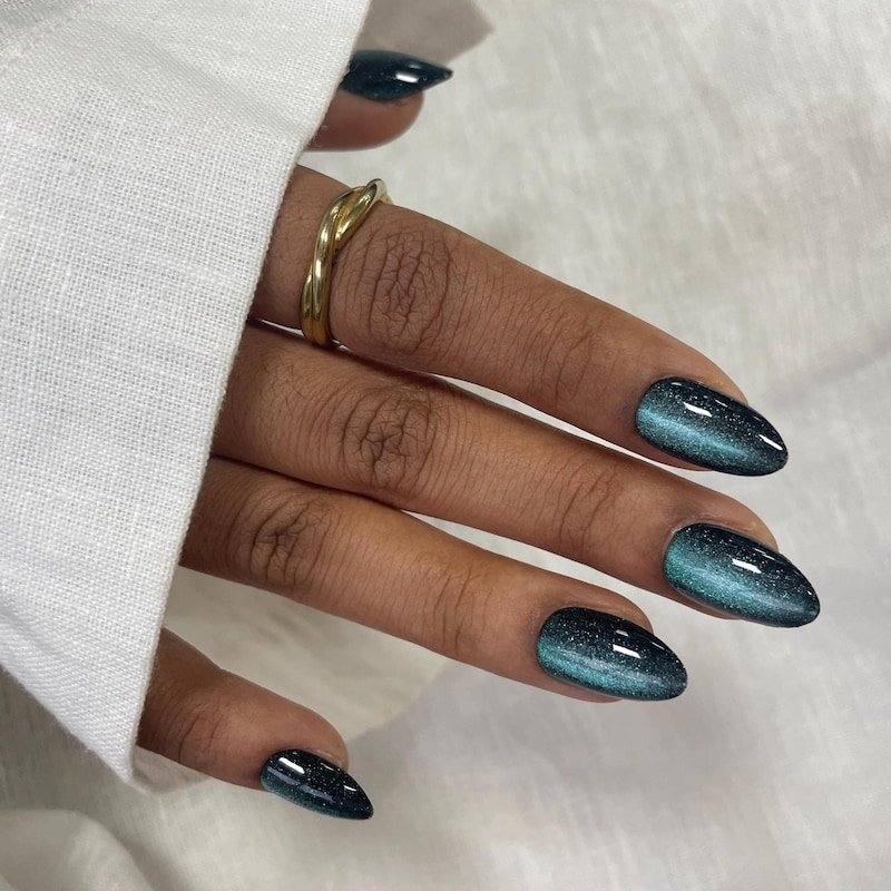 Dark Teal Glitter Cat Eye Almond Nails for Winter Date Nights