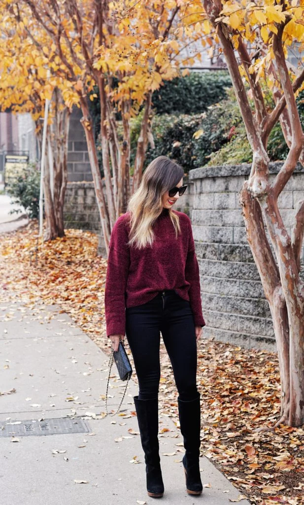 50 Thermal Layering Outfits for Cold January Days That Are Chic, Warm and Elegant 8 White Thermal Top under a Burgundy Knit Sweater with Dark Jeans and Black Knee-high Boots