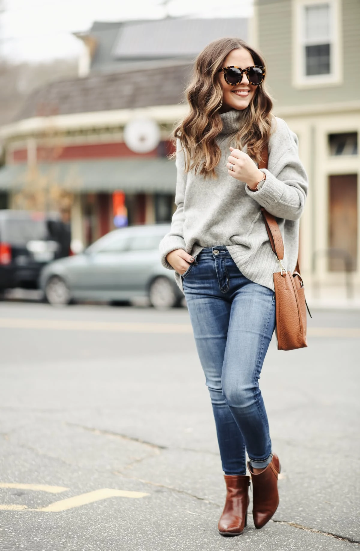 50 Thermal Layering Outfits for Cold January Days That Are Chic, Warm and Elegant 13 Grey Thermal Top under a Cream Knit Sweater with Blue Jeans and Brown Ankle Boots