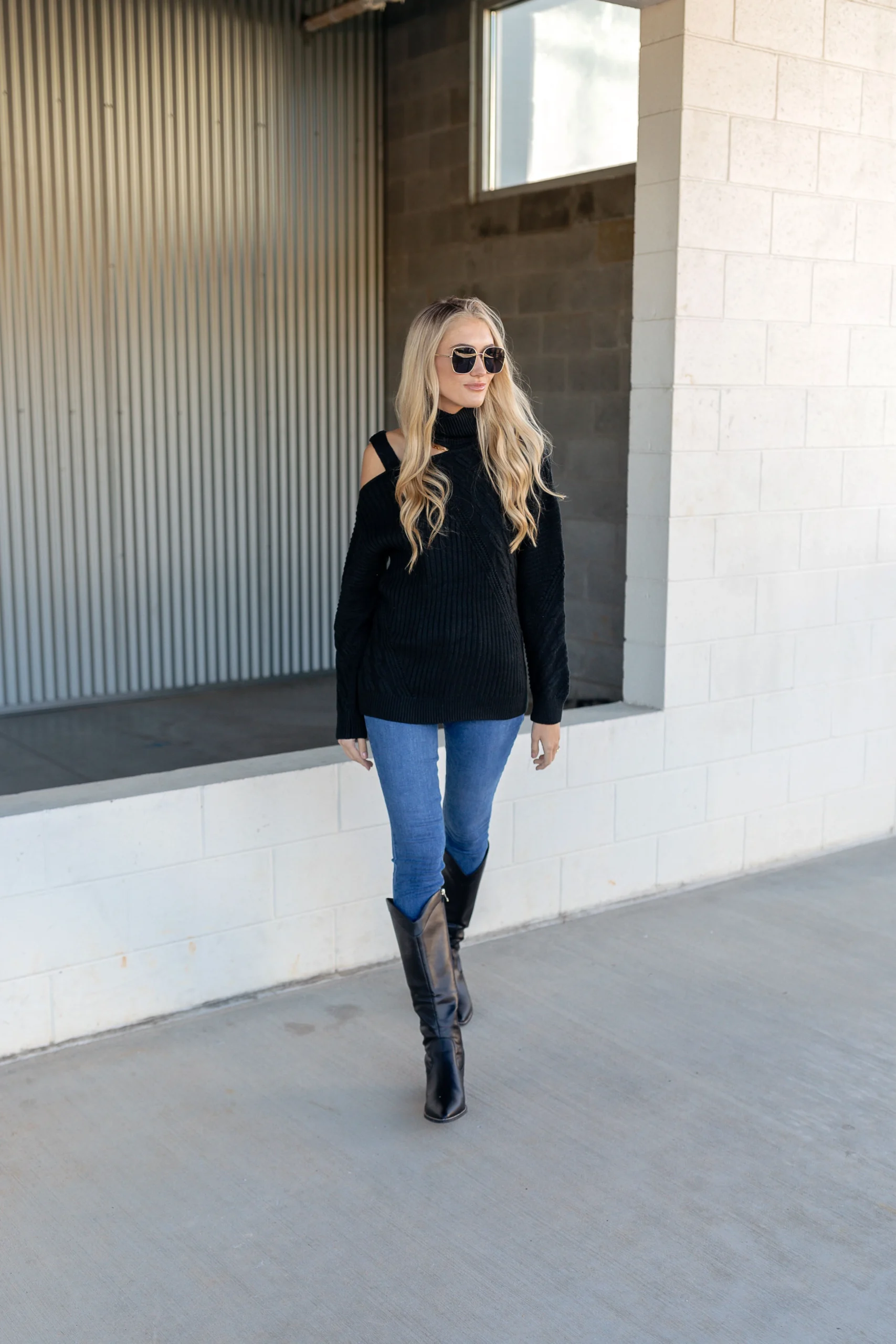 50 Thermal Layering Outfits for Cold January Days That Are Chic, Warm and Elegant 18 Burgundy Thermal Top under a Black Knit Sweater with Blue Jeans and Black Knee-high Boots