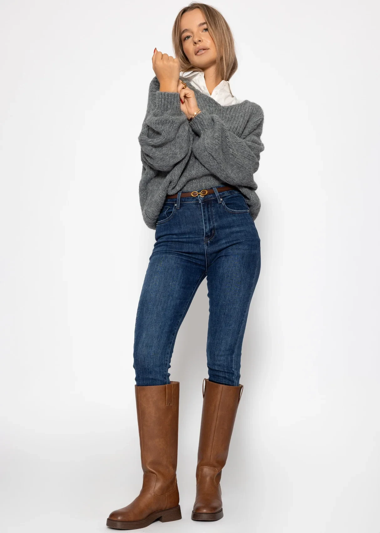 50 Thermal Layering Outfits for Cold January Days That Are Chic, Warm and Elegant 21 Navy Thermal Top under a Grey Chunky Knit Sweater with Blue Jeans and Dark Brown Boots