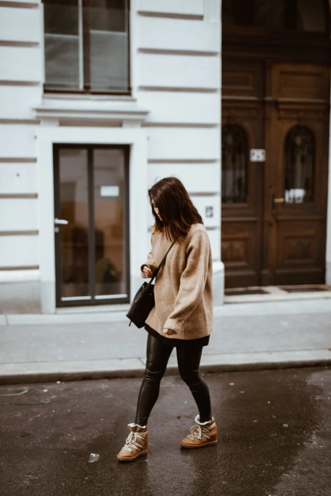 50 Thermal Layering Outfits for Cold January Days That Are Chic, Warm and Elegant 28 Burgundy Thermal Top under a Camel Knit Sweater with Black Leggings and Tan Boots