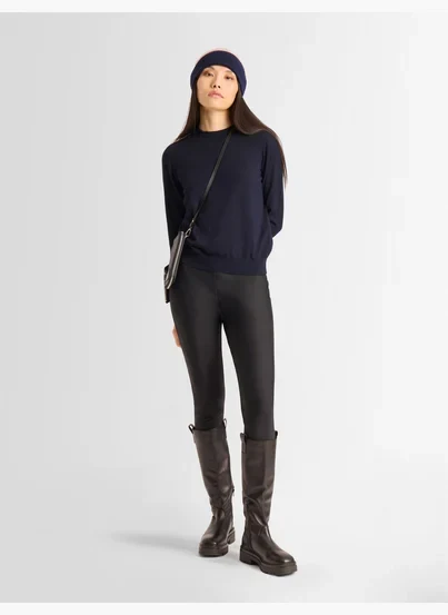 50 Thermal Layering Outfits for Cold January Days That Are Chic, Warm and Elegant 44 White Thermal Top under a Navy Knit Sweater with Black Leggings and Dark Brown Boots